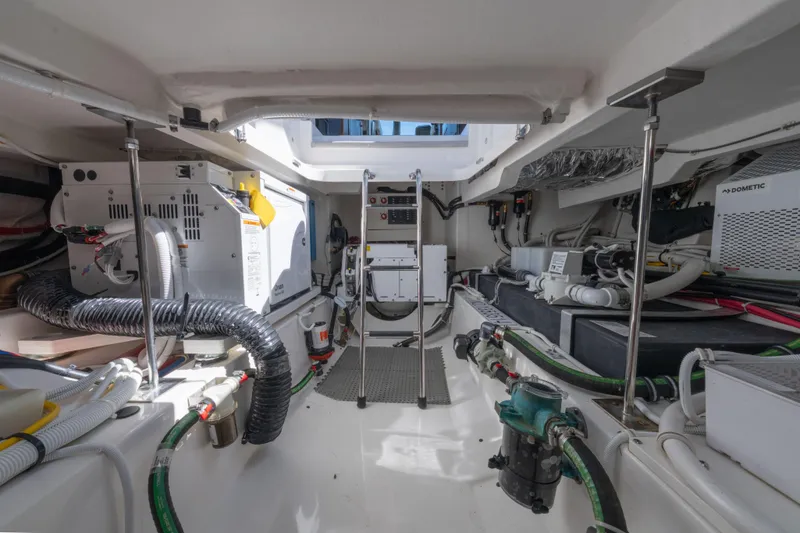 Slide: The Image of Engine room of 2025 Tiara Yachts 43 LE, showcasing equipment and wiring. - 43