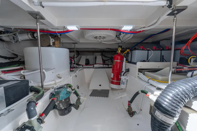 Slide: The Image of Engine room of 2025 Tiara Yachts 43 LE, showcasing equipment and wiring. - 44