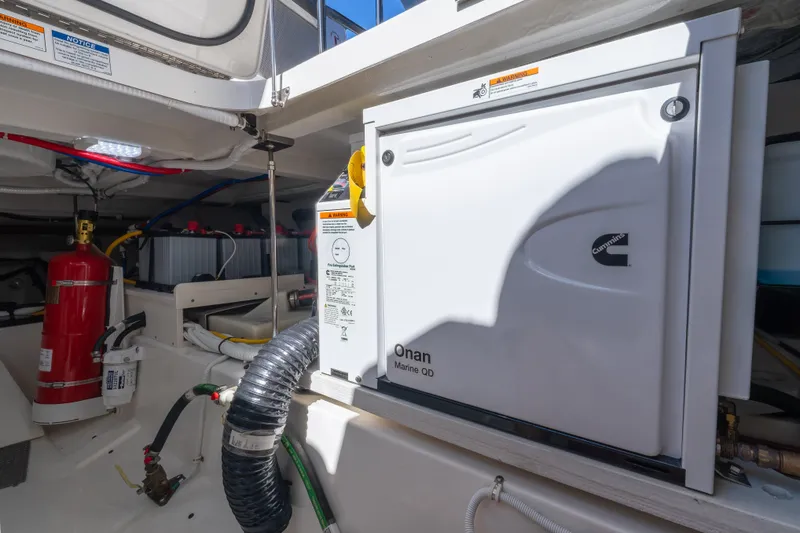 Slide: The Image of Engine room of 2025 Tiara Yachts 43 LE with Cummins Onan generator. - 45