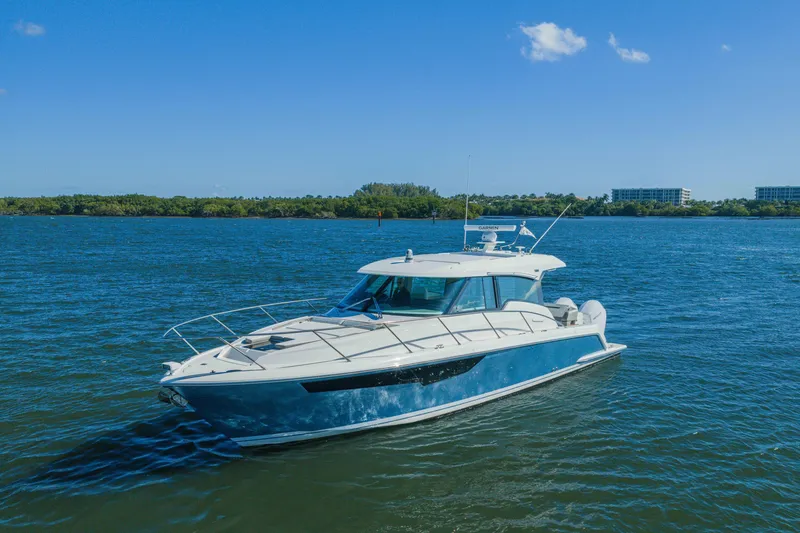 Slide: The Image of 2025 Tiara Yachts 43 LE cruising on a sunny day in open water. - 47