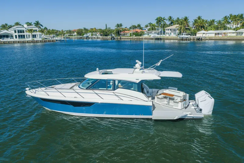 Slide: The Image of 2025 Tiara Yachts 43 LE luxury boat cruising on a sunny day. - 51