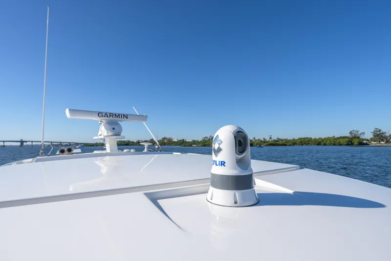 Slide: The Image of 2025 Tiara Yachts 43 LE with Garmin and FLIR technology on open water. - 6