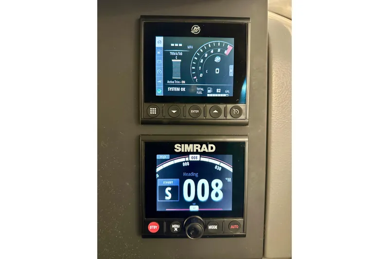 Slide: The Image of 2023 Nimbus Weekender 9 dashboard with Simrad navigation and fuel display. - 14