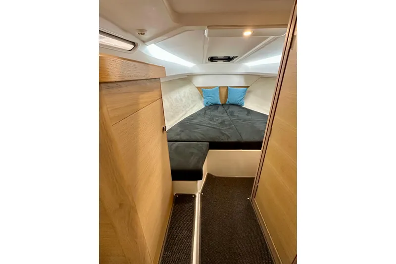 Slide: The Image of 2023 Nimbus Weekender 9 cabin interior with cozy bed and modern design. - 31