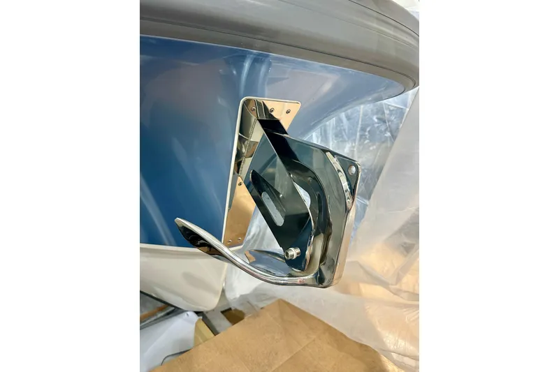 Slide: The Image of Chrome anchor detail on 2023 Nimbus Weekender 9 boat, showcasing sleek design. - 41