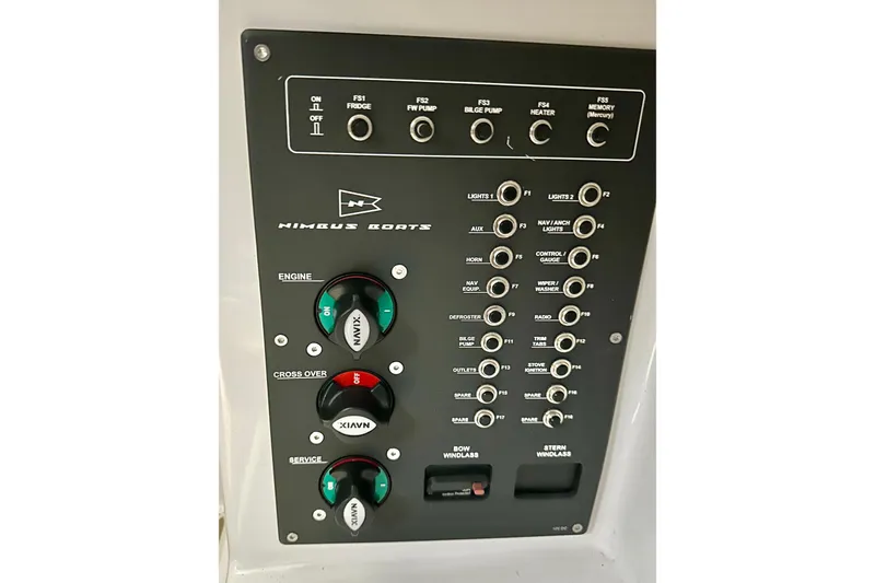 Slide: The Image of Control panel of 2023 Nimbus Weekender 9 boat with various switches and dials. - 46