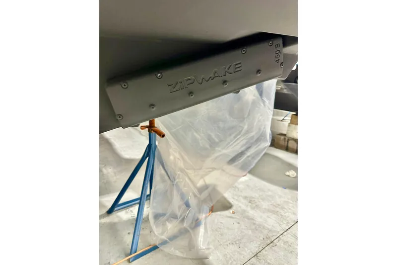 Slide: The Image of 2023 Nimbus Weekender 9 with Zipwake system on a boat stand. - 53