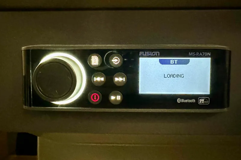 Slide: The Image of Fusion MS-RA70N stereo system displaying Bluetooth loading screen on Nimbus Weekender 9, 2023 model. - 15