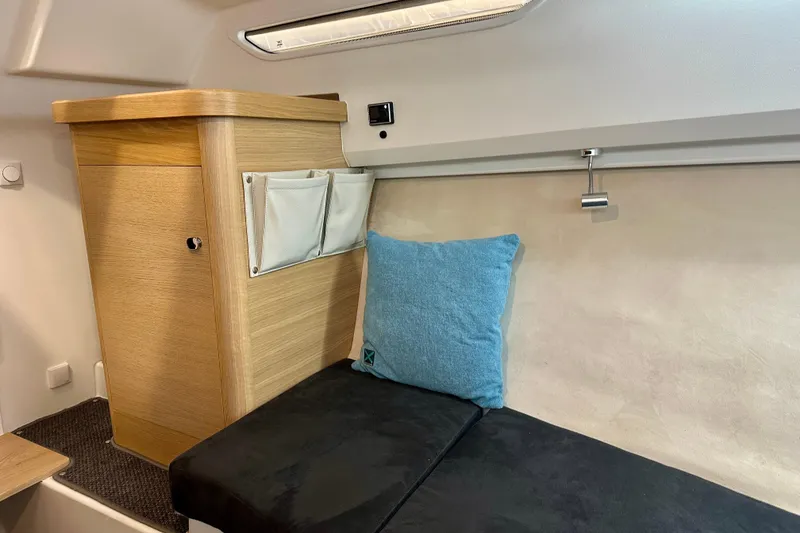 Slide: The Image of Interior of 2023 Nimbus Weekender 9, featuring cozy seating and wooden cabinetry. - 35