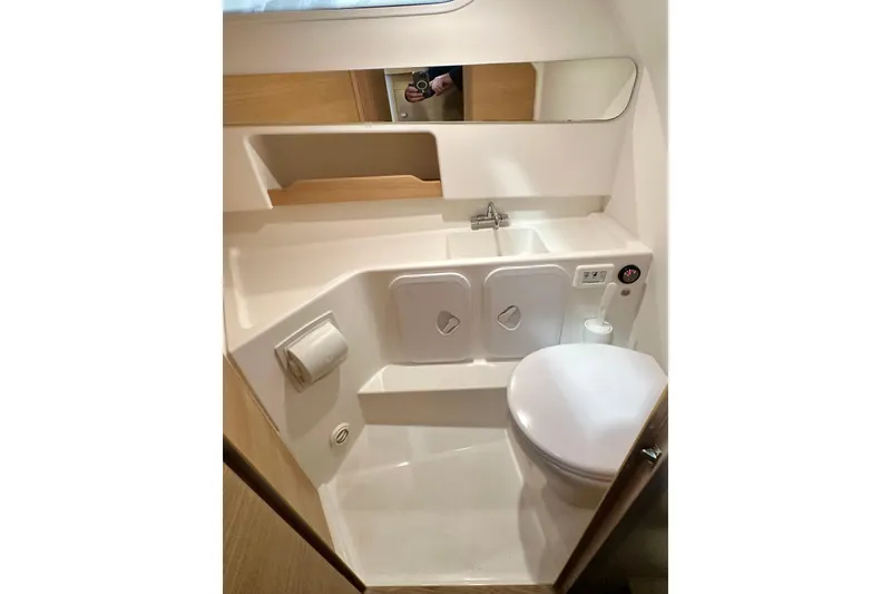 Slide: The Image of Compact bathroom in 2023 Nimbus Weekender 9 boat, featuring sink, toilet, and storage. - 37