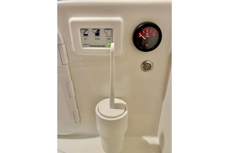 Slide: The Image of Control panel and gauge in 2023 Nimbus Weekender 9 boat bathroom. - 39