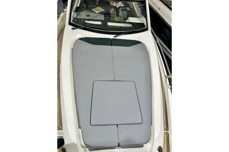 Slide: The Image of 2023 Nimbus Weekender 9 boat with gray cushioned deck, sleek design. - 43