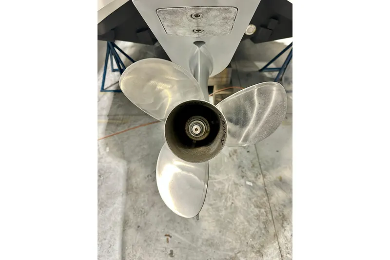 Slide: The Image of 2023 Nimbus Weekender 9 boat propeller in a workshop setting. - 52