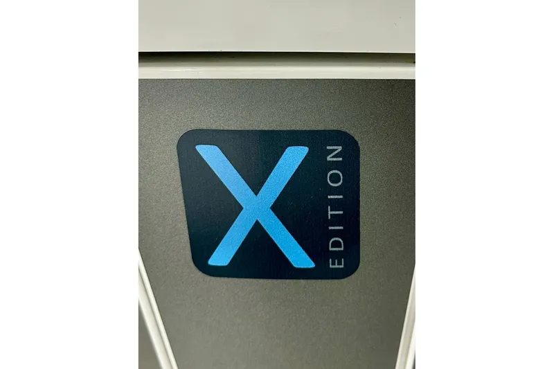 Slide: The Image of 2023 Nimbus Weekender 9 X Edition logo on a sleek gray surface. - 55