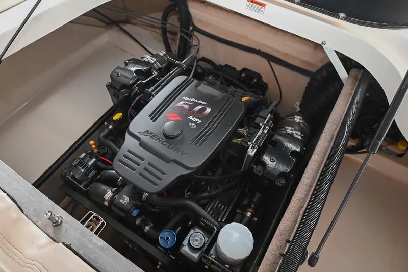 Slide: The Image of 2007 Bryant 270 boat engine compartment featuring a Mercury 350 MPI engine. - 12