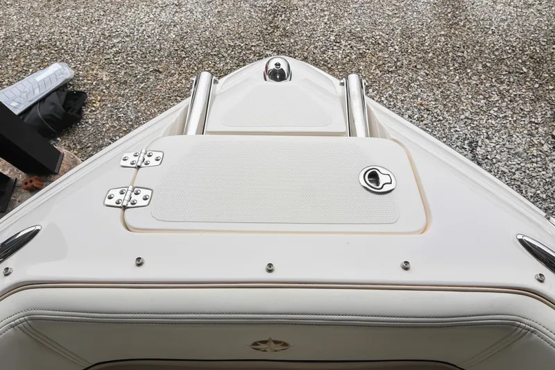 Slide: The Image of 2007 Bryant 270 boat bow with white deck and stainless steel fittings. - 13