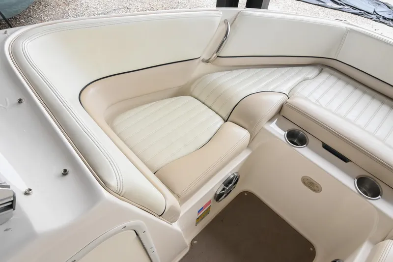 Slide: The Image of Luxurious seating in a 2007 Bryant 270 boat with white leather upholstery. - 24