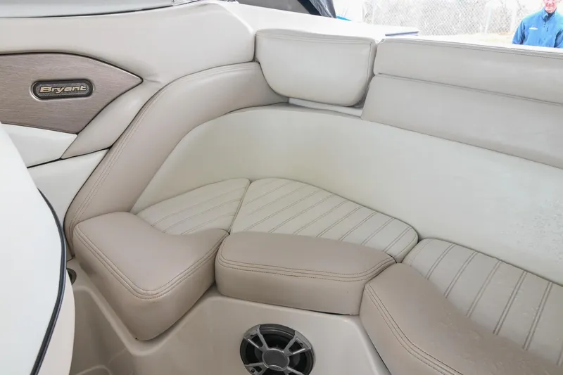 Slide: The Image of Interior of a 2007 Bryant 270 boat with beige seating and speaker. - 26