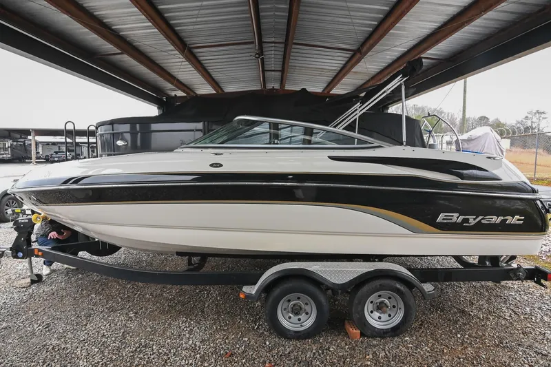 Slide: The Image of 2007 Bryant 270 boat on trailer under metal roof, side view. - 30