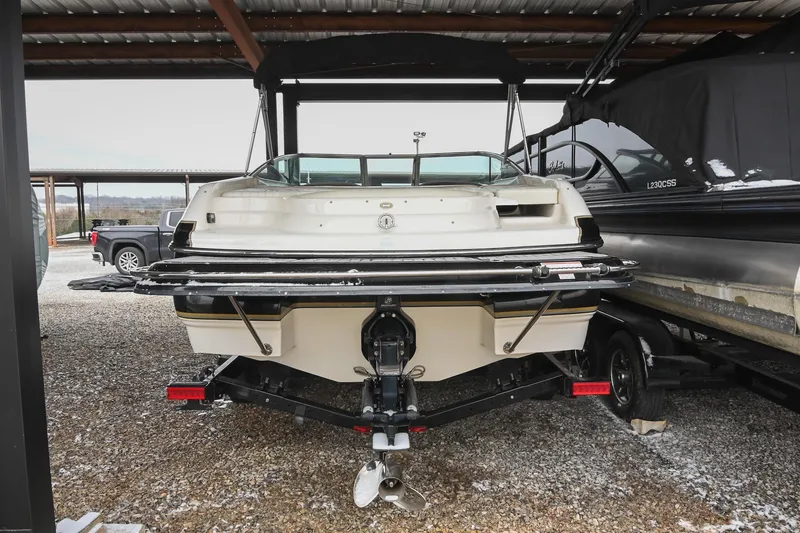 Slide: The Image of 2007 Bryant 270 boat on trailer in covered storage area. - 37