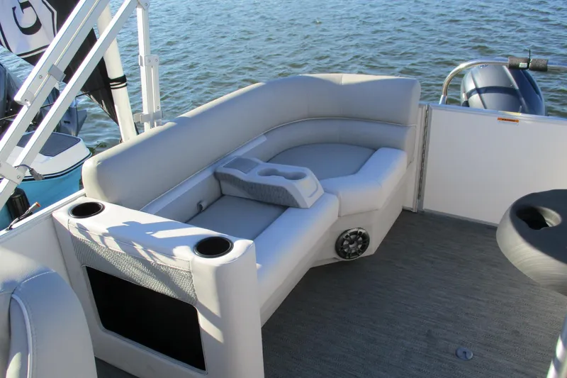 Slide: The Image of 2024 Godfrey Sweetwater 2286 SBX pontoon boat interior with plush seating and cup holders. - 3