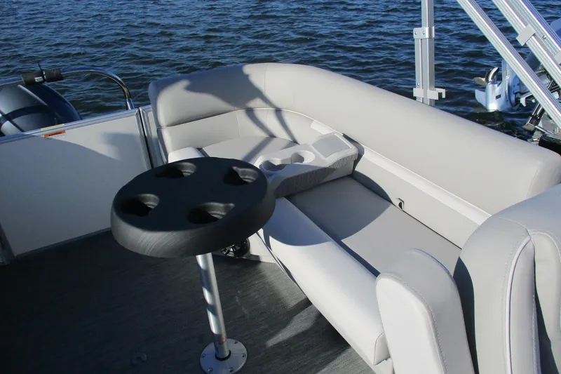 Slide: The Image of 2024 Godfrey Sweetwater 2286 SBX pontoon boat interior with seating and cup holders. - 4