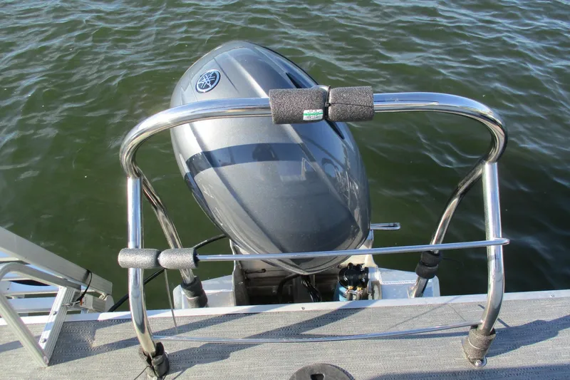 Slide: The Image of 2024 Godfrey Sweetwater 2286 SBX boat with Yamaha outboard motor on water. - 5