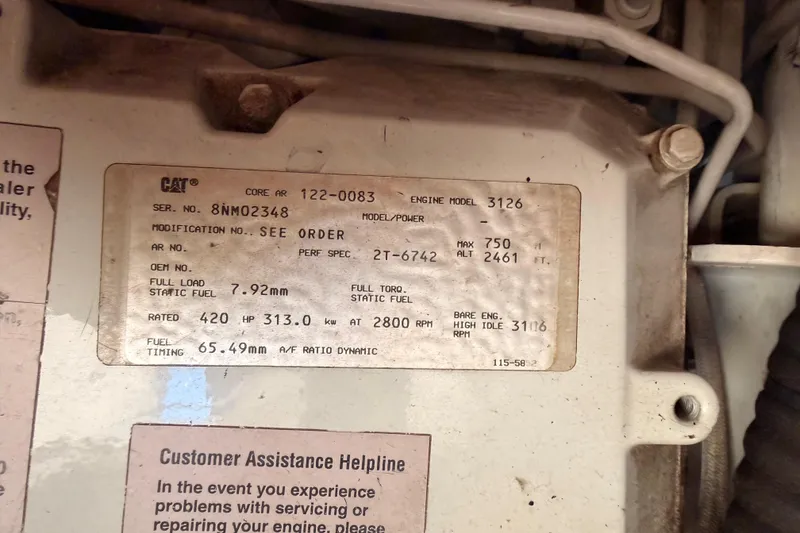Slide: The Image of Engine specifications label on a 1998 Sea Ray 420 Aft Cabin boat. - 101