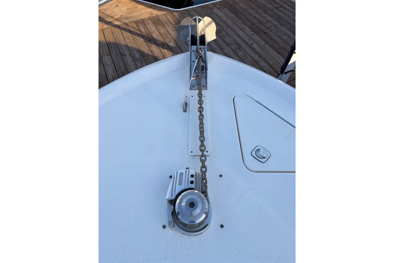 Slide: The Image of 1998 Sea Ray 420 Aft Cabin boat anchor chain and winch on deck. - 17