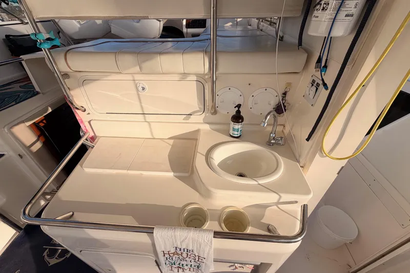 Slide: The Image of 1998 Sea Ray 420 Aft Cabin yacht interior with sink and countertop area. - 25