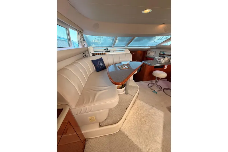 Slide: The Image of Luxurious interior of 1998 Sea Ray 420 Aft Cabin yacht with plush seating and elegant decor. - 45