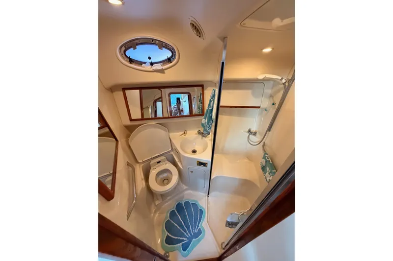 Slide: The Image of Bathroom interior of 1998 Sea Ray 420 Aft Cabin yacht with shower and toilet. - 59