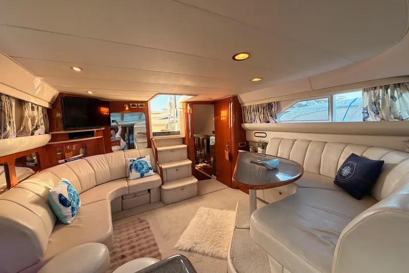 Slide: The Image of Luxurious interior of 1998 Sea Ray 420 Aft Cabin yacht with plush seating and elegant decor. - 71