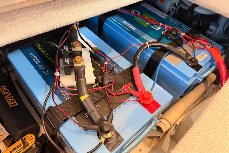 Slide: The Image of Battery compartment of a 1998 Sea Ray 420 Aft Cabin with wiring and connections. - 88