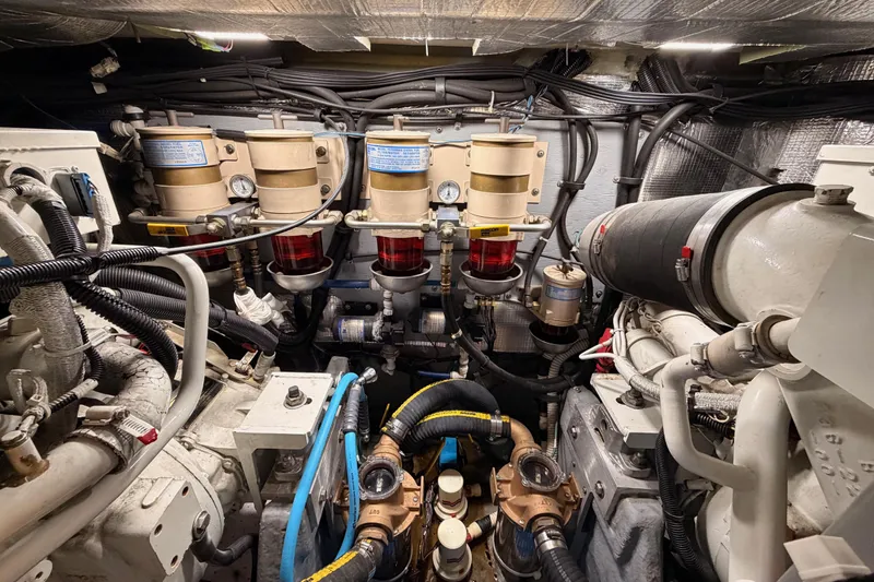 Slide: The Image of Engine room of a 1998 Sea Ray 420 Aft Cabin with mechanical components. - 93