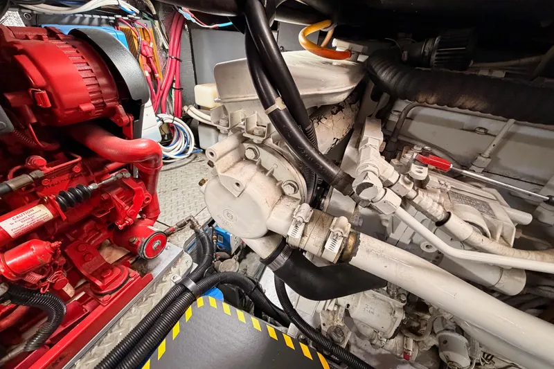 Slide: The Image of Engine room of a 1998 Sea Ray 420 Aft Cabin with visible machinery and components. - 98