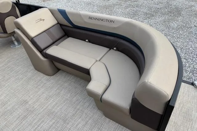 Slide: The Image of 2025 Bennington 23 SXPD boat seating, featuring luxurious beige and brown upholstery. - 10