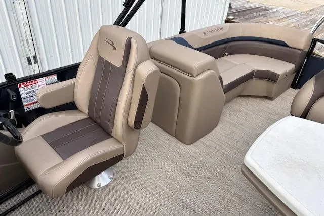 Slide: The Image of 2025 Bennington 23 SXPD boat interior with beige and brown seating, showcasing luxury design. - 12