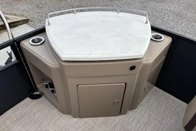 Slide: The Image of 2025 Bennington 23 SXPD boat interior with storage and cup holders. - 15