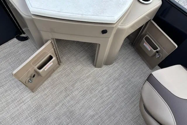 Slide: The Image of Interior of 2025 Bennington 23 SXPD boat with storage compartments and seating. - 16