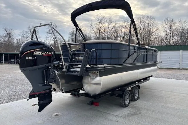 Slide: The Image of 2025 Bennington 23 SXPD pontoon boat with Yamaha engine on trailer. - 3