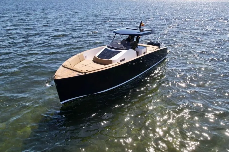 Slide: The Image of 2023 Tesoro T38 luxury yacht cruising on sparkling water. - 14