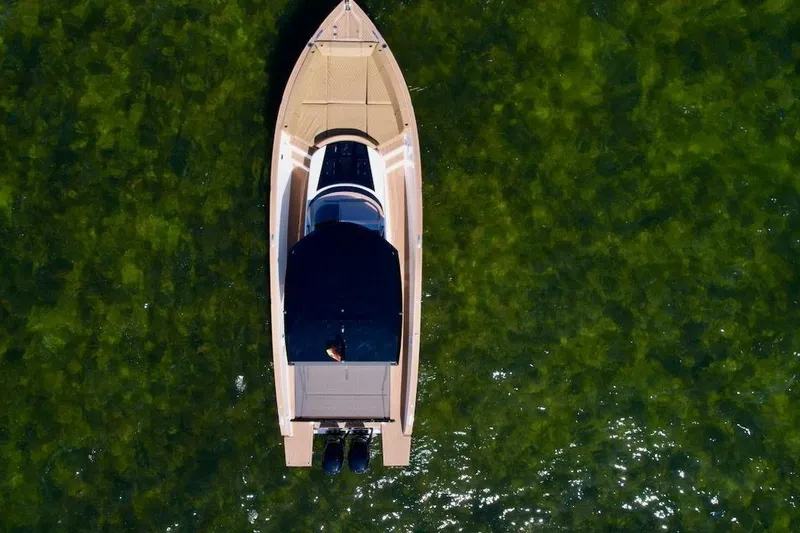 Slide: The Image of Aerial view of 2023 Tesoro T38 boat on clear green water. - 16
