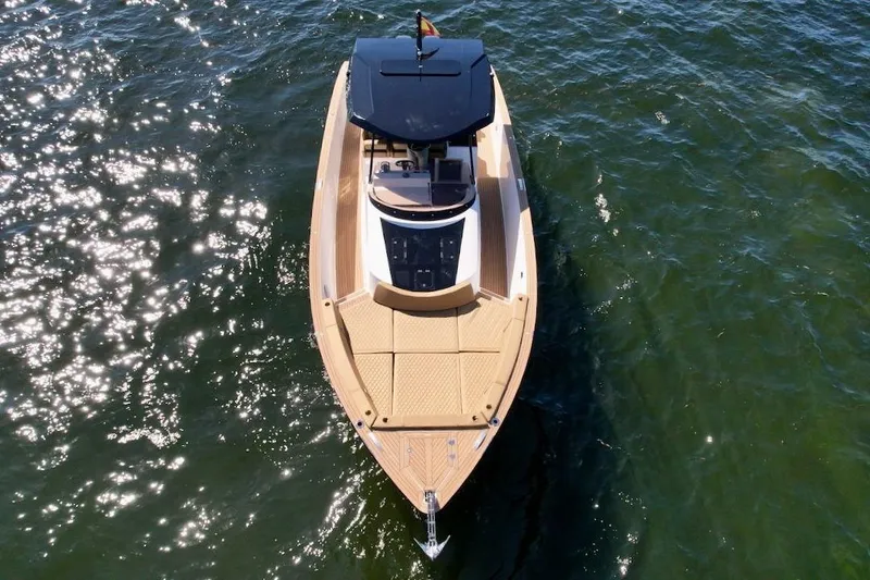 Slide: The Image of 2023 Tesoro T38 luxury boat on sparkling water, aerial view. - 20