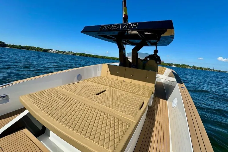 Slide: The Image of 2023 Tesoro T38 boat with cushioned deck, cruising on a sunny day. - 23