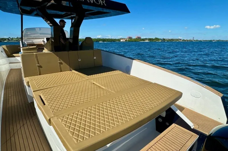 Slide: The Image of 2023 Tesoro T38 luxury boat with spacious sun deck on open water. - 25