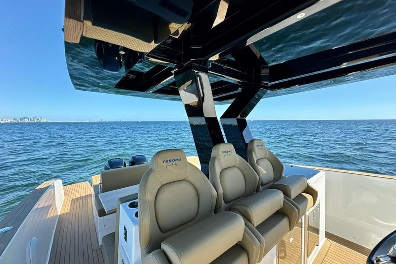 Slide: The Image of 2023 Tesoro T38 luxury yacht interior with ocean view and comfortable seating. - 32