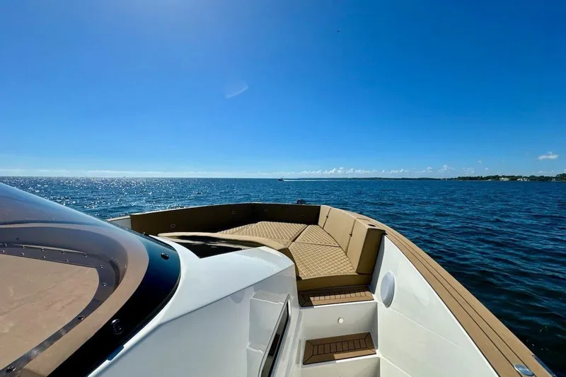 Slide: The Image of 2023 Tesoro T38 yacht cruising on a sunny day with clear blue skies. - 33