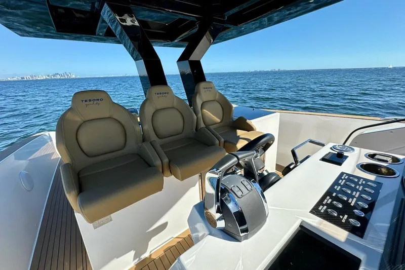 Slide: The Image of Luxury Tesoro T38 yacht interior with modern helm and seating, 2023 model. - 39