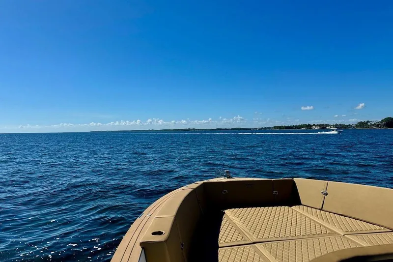 Slide: The Image of 2023 Tesoro T38 boat on open sea under clear blue sky. - 42